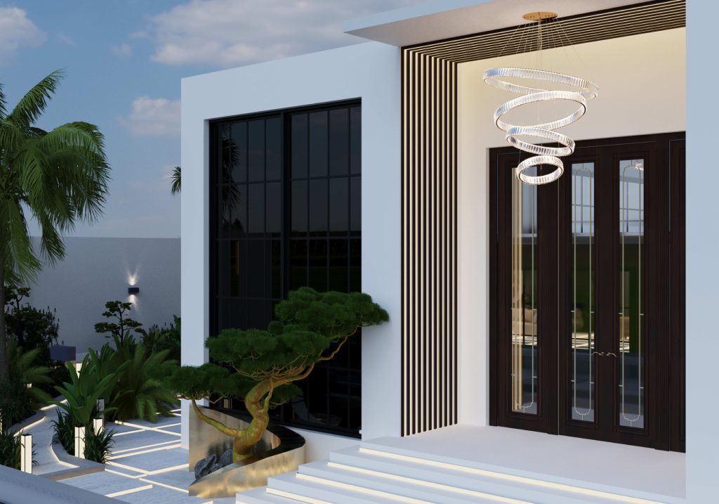 Modern luxury exterior entrance featuring a bold architectural design with clean white walls, black-framed windows, and dramatic dark double doors. The entry is highlighted by a sculptural spiral chandelier, vertical wood slats, and minimalist landscaping with a shaped bonsai tree, integrated lighting, and sleek pathway lines